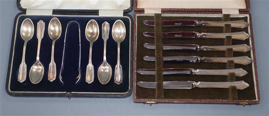 Three cased silver cutlery sets, coffee spoons with tongs, tea knives and six pairs of dessert eaters.